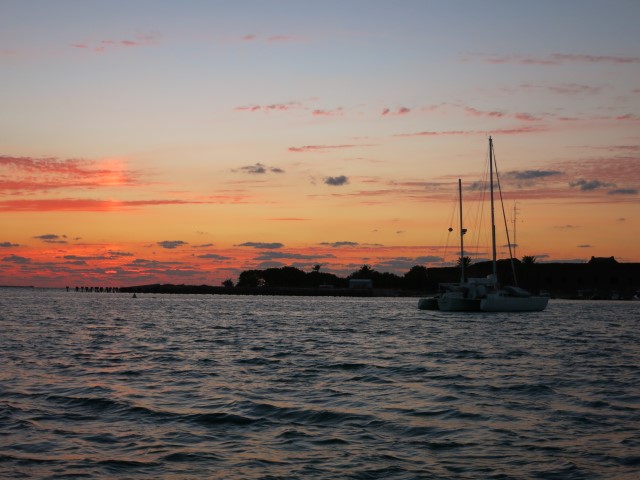 Safely back at anchor, watching the sunset.  A cool sun pillar.