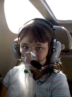Katie in her flying gear at 16,000 feet