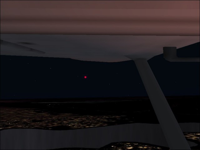 Red light hovering over Lake Arlington abeam on my left.