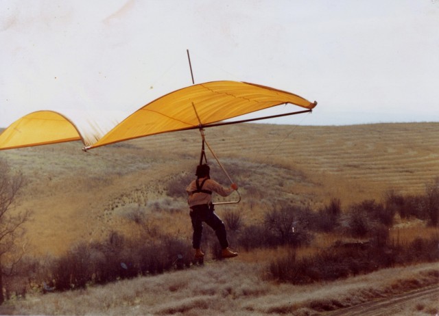 Russ flying Chandelle from reservoir levy; March 1981.